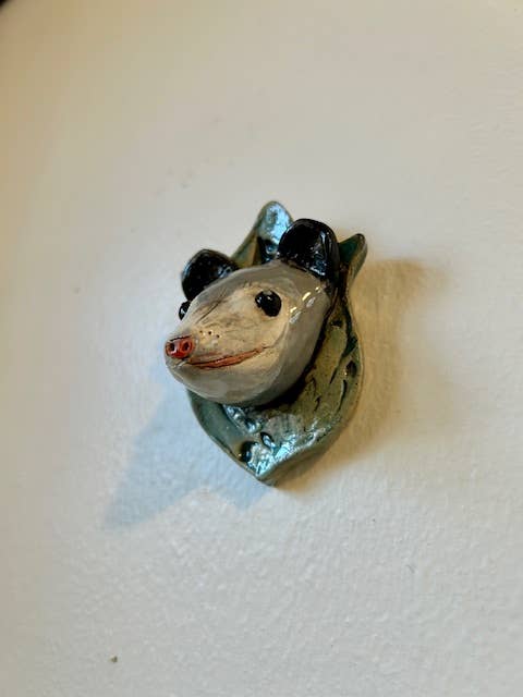 Opossum on a Plaque