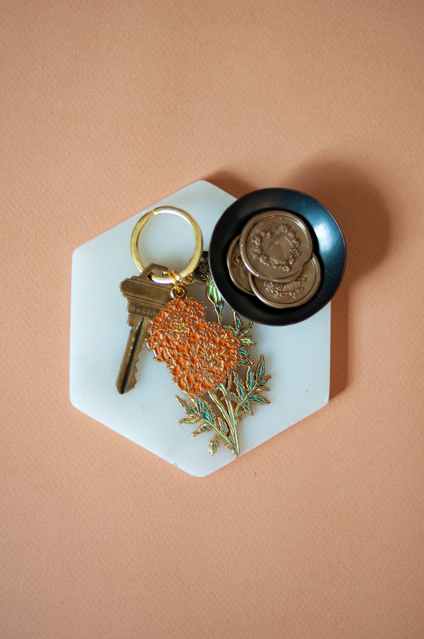 Orange marigold soft enamel keychain
