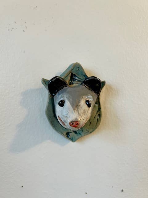 Opossum on a Plaque