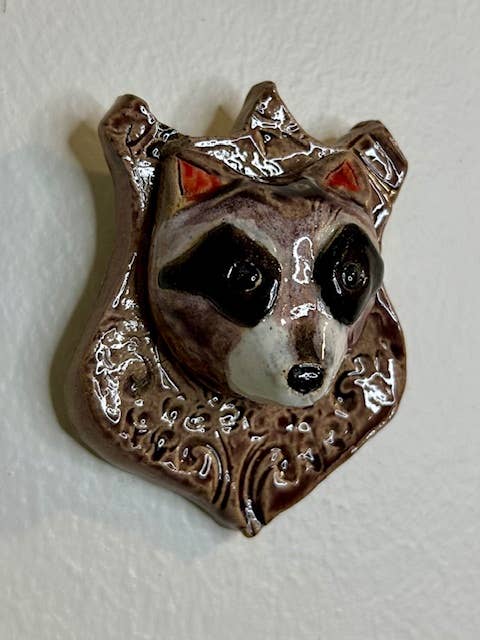 Raccoon on a Plaque