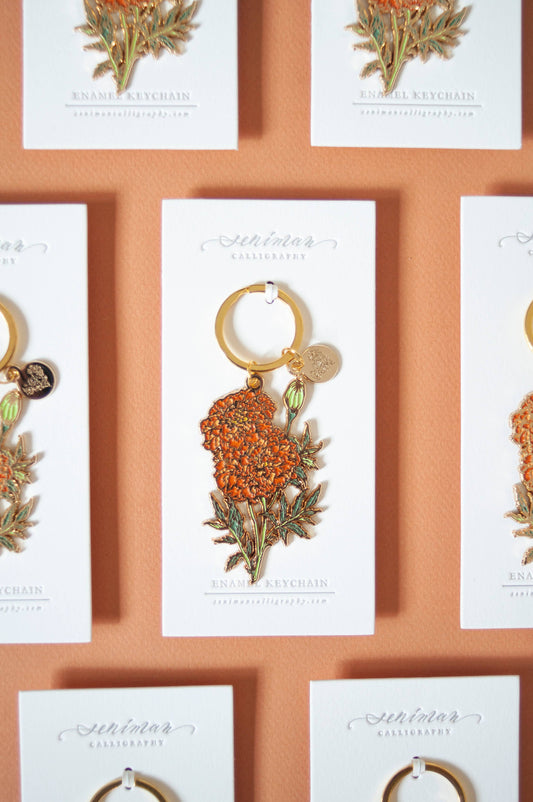 Orange marigold soft enamel keychain