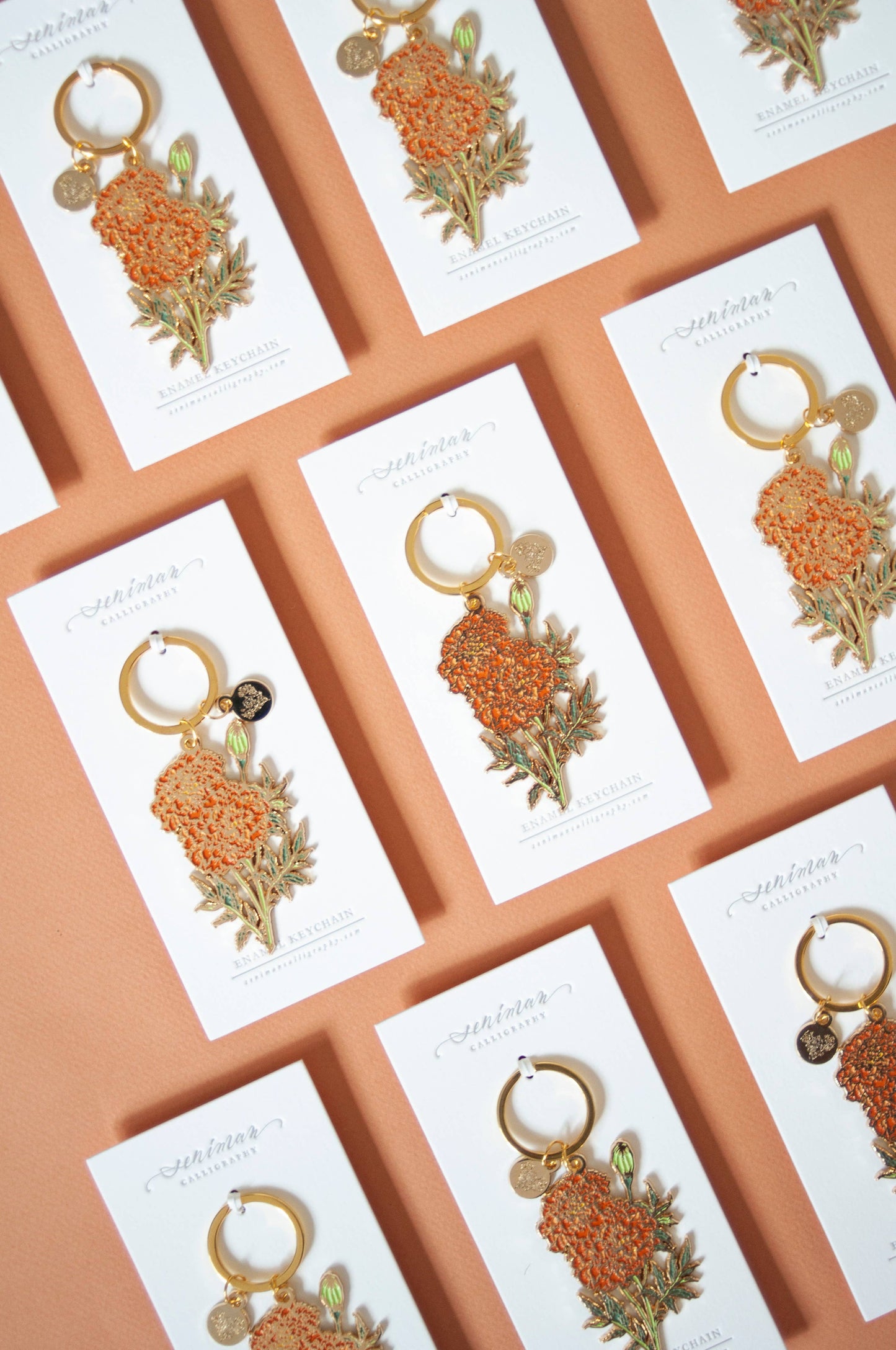 Orange marigold soft enamel keychain