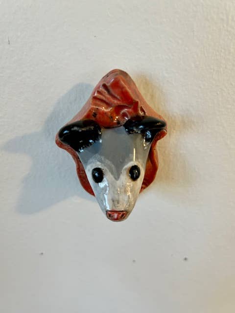 Opossum on a Plaque