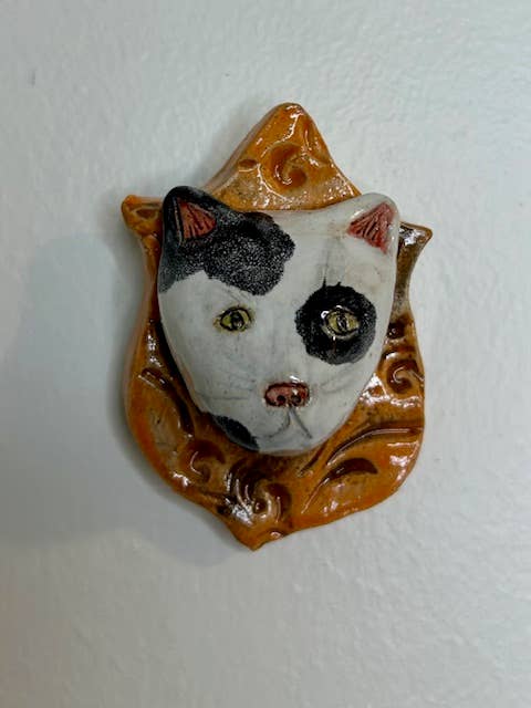 Cat on a Plaque