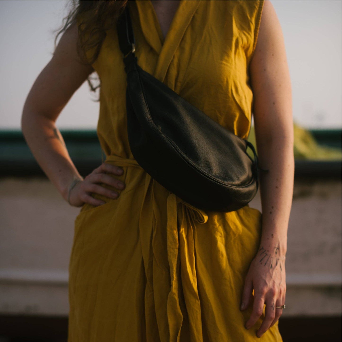 Pebbled Leather Moon Sling Bag - Black