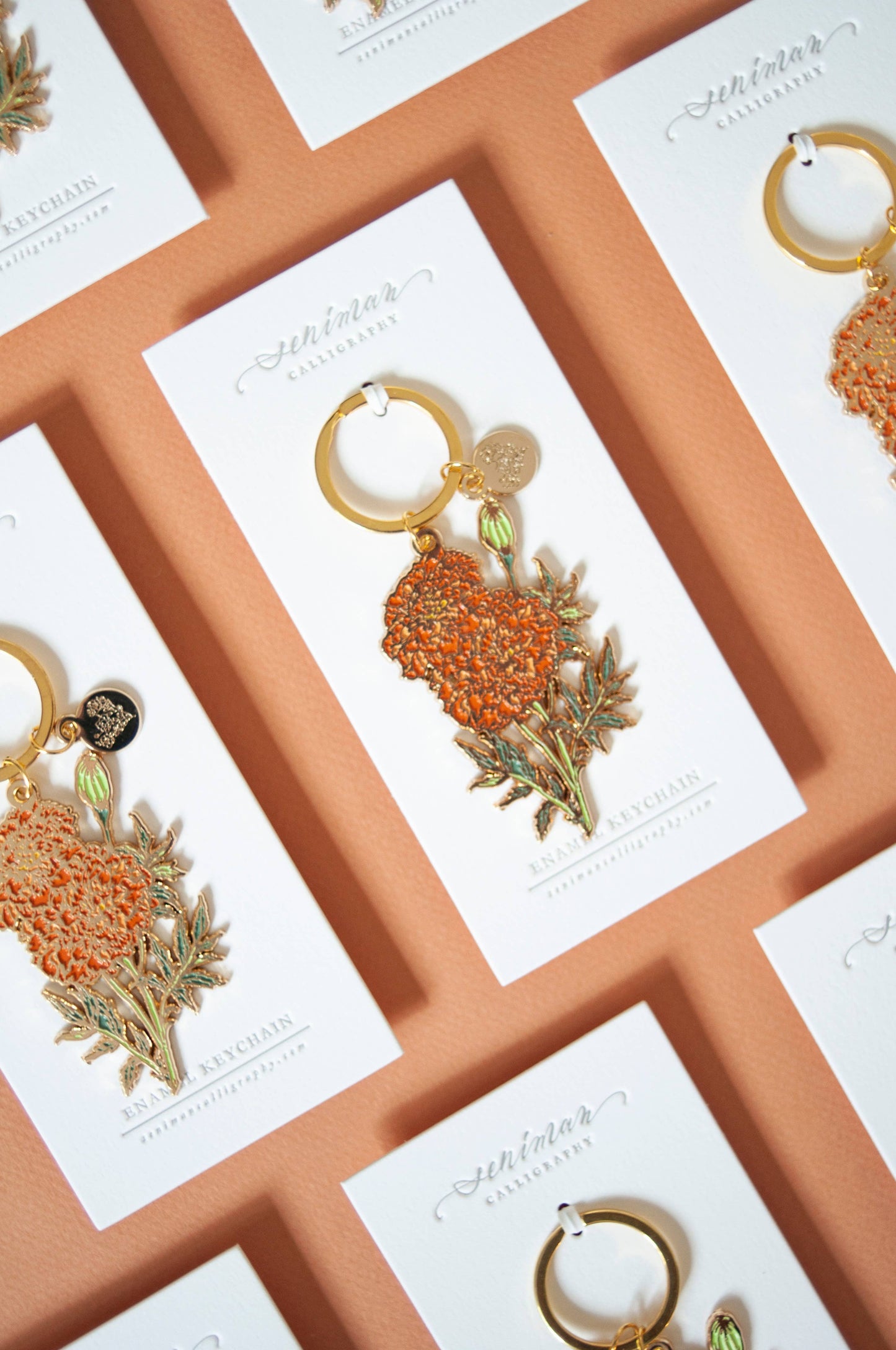 Orange marigold soft enamel keychain