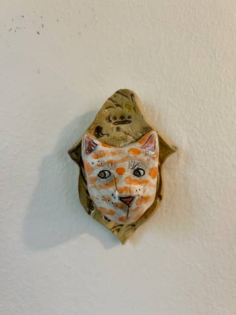Cat on a Plaque